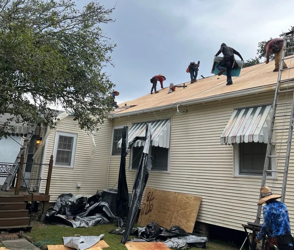 Texas roofing contractor inspecting residential roof with homeowner