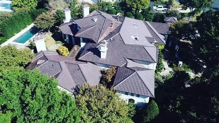 Beautiful Houston Texas home with new roof replacement showing hurricane-resistant installation